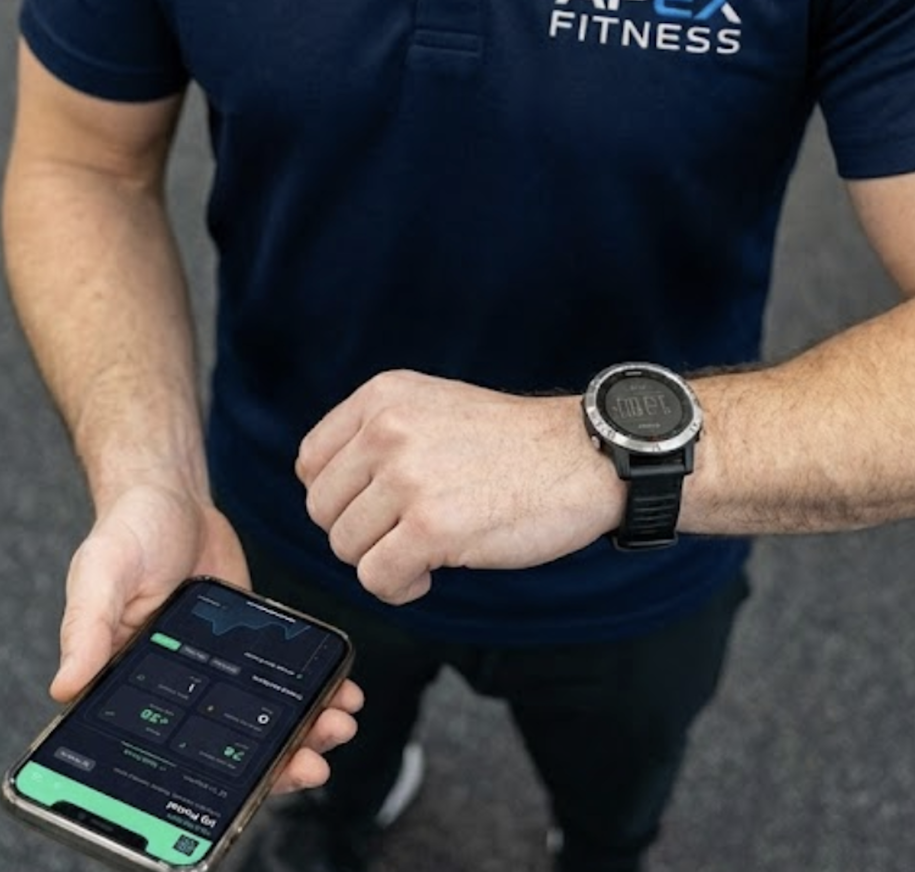 Personal trainer checking phone for client no-show notifications